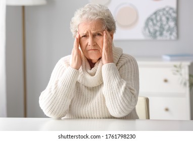 Elderly Woman Video Chatting With Doctor At Home