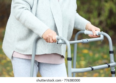 Elderly Woman With Walking Frame Outdoors, Closeup