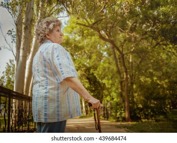 Elderly Woman With Walking Stick