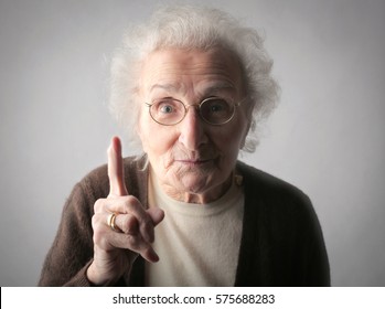 Elderly woman warning you