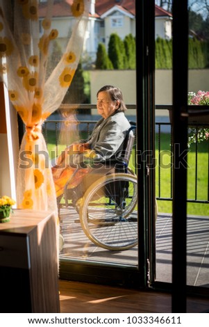 Similar – Older woman in a wheelchair