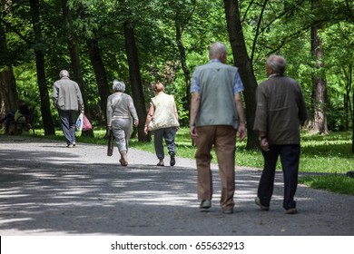 Elders, Older People Walking And Recreationing In Park In Nowa Huta.