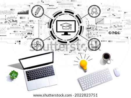 E-learning concept with computers with a light bulb from above