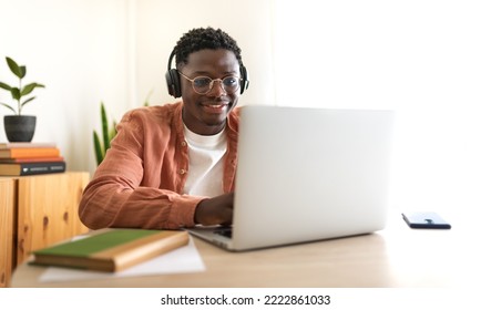 E-learning concept. Teen African American college student taking online lessons.Panoramic image. - Powered by Shutterstock