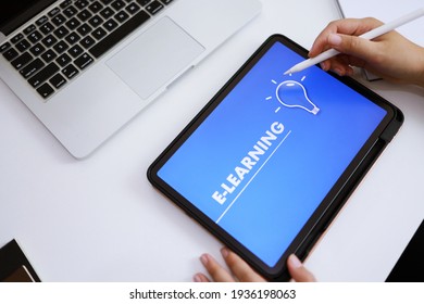 E-Learning concept with website on tablet. Education Internet Technology Web Online