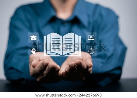 E-learning education, Personal development, learning online with webinar, video tutorial, internet lessons. Businessman holding E-learning icon on virtual screen.