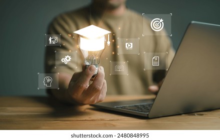 E-learning graduate certificate program concept. man holding lightbulb showing graduation hat, Internet education course degree, study knowledge to creative thinking idea and problem solving solution