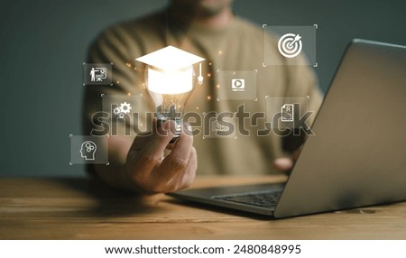 E-learning graduate certificate program concept. man holding lightbulb showing graduation hat, Internet education course degree, study knowledge to creative thinking idea and problem solving solution