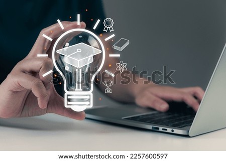 E-learning graduate, certificate program, person holding light bulb with graduation hat and education course icons on desk, people learning, creative thinking, idea concept.