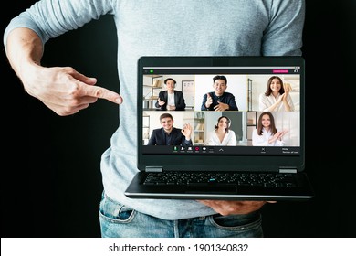 Elearning webinar. Video chat. Online education. Business coaching. Man presenting tutorial program pointing at laptop screen with diverse students teacher remote communication isolated on black.
