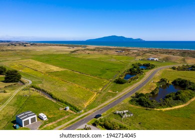 An Eleavated Shot Of The Te Horo Lifestyle Beach Properties With A Calm Tasman Sea And Kapiti Island. Small Dune Lakes, Remnants Of The Drained Wetland Can Be Seen