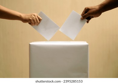 election box, election day concept, people's hands putting ballot envelopes into the election box.