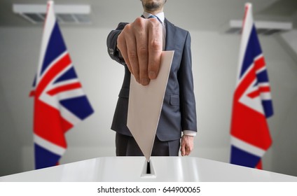 Election Or Referendum In Great Britain. Voter Holds Envelope In Hand Above Ballot. United Kingdom Flags In Background.