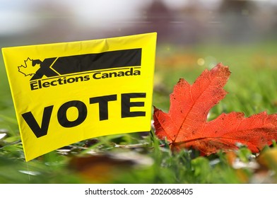 Elections Canada Vote Sign With Red Maple Leaf On Green Grass