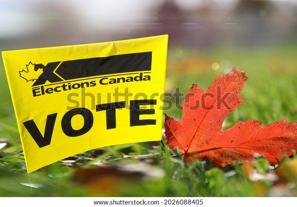 Elections Canada Vote sign with red maple leaf on green grass
