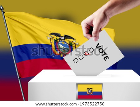 Elections in the Ecuador. The hand that puts the game in the ballot box. Ecuador flags in the background. Country flag election.