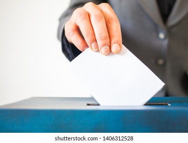 Elections, The Hand Of Woman Putting Her Vote In The Ballot Box