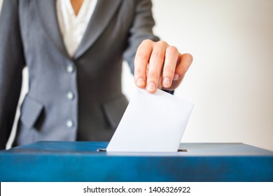 Elections, The Hand Of Woman Putting Her Vote In The Ballot Box