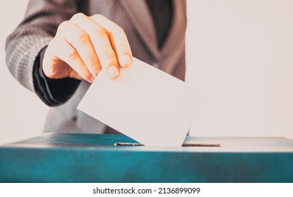 Elections, The Hand Of Woman Putting Her Vote In The Ballot Box