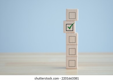 Elections And Voting, Vote, To Do List, Checklist, Task List, Exam ,Survey And Assessment Concept. Check Mark On Wooden Block And Blank Check Box On Wooden Cubes.