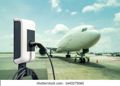 Electric Aircraft Charger Station With Plug And Power Cable Supply On Cargo Or Airplane Parking With Blue Sky Background