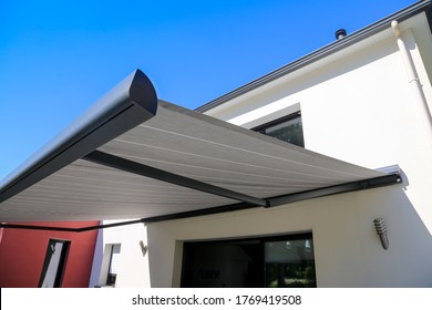 Electric Aluminum Modern Awning On  A Modern House