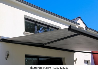 Electric Aluminum Modern Awning On  A Modern House