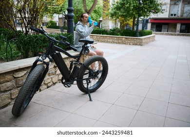 Electric bike motorbike bicycle for sharing. Parked e-bike in the city, ready for renting. Bike sharing city service. Sustainability. Environmental conservation. Eco-friendly mode of urban transport - Powered by Shutterstock