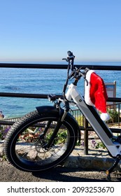 Electric Bike On Beach Bike Path With Santa Hat