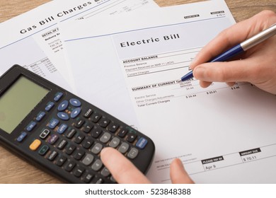 Electric bill charges paper form on the table - Shutterstock ID 523848388