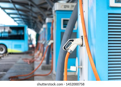 Electric Bus Stands At The Charger