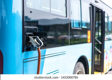 Electric Bus Stands At The Charger