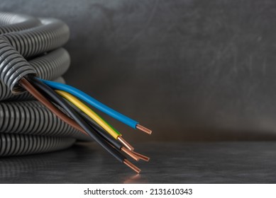 Electric Cable with Corrugated Conduit Pipe Close-up - Shutterstock ID 2131610343