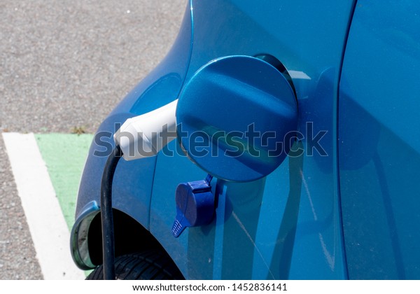 Electric car changing on street parking in future\
EV vehicle concept