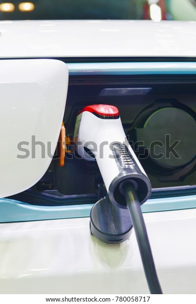 Electric car charger on charging with connection\
plug and socket.