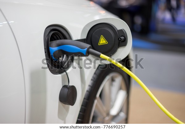 Electric car\
charger. Power supply electric car charging for electric car\
technology transportation in the\
future.