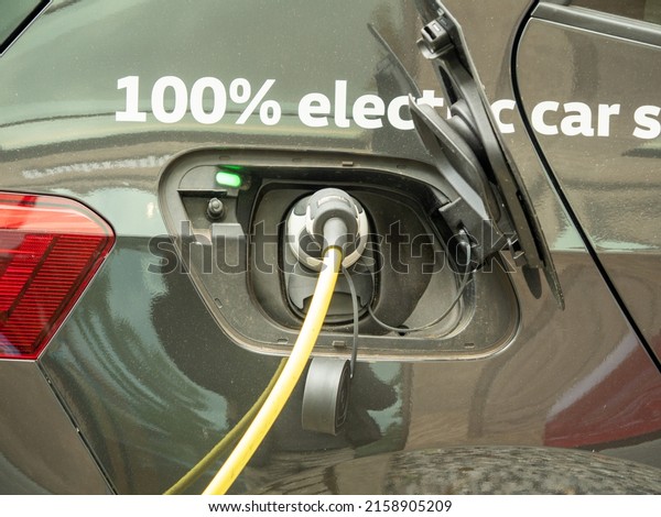 The electric car\
is charging. Car charging.
