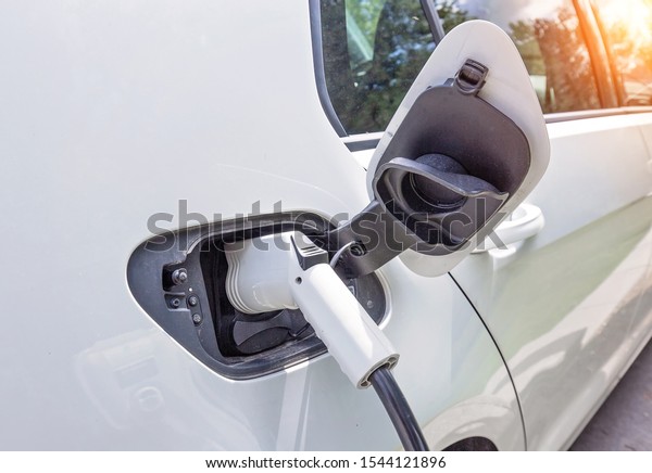 Electric car charging the battery from the\
electric charger