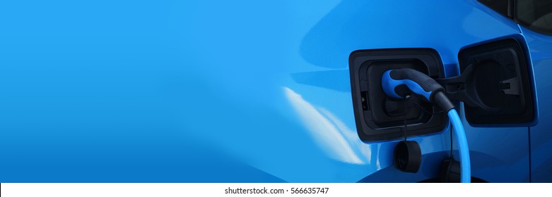 Electric car charging on charge station – electro mobility environment friendly – copy space