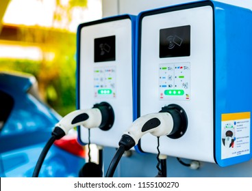 Electric car charging station for charge EV battery. Plug for vehicle with electric and hybrid engine. EV charger. Clean energy. Charging point for EV car. Green power . Future transport technology.