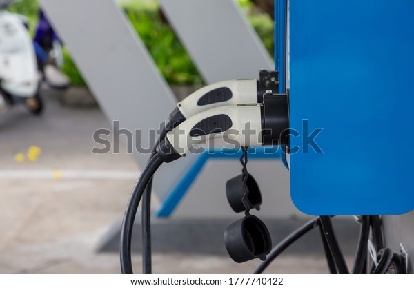 Electric car charging station. Hybrid car
Electric charger station in the Car Park. Electric car charging on
parking and charging
station.