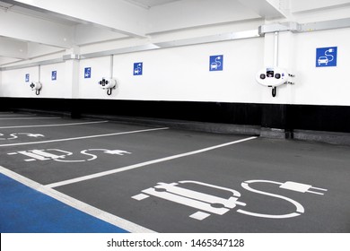 Electric car charging station in indoor parking garage