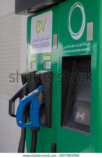 Electric car charging station with\
the power cable at Petrol Station Enoc Dubai on\
19-01-2021