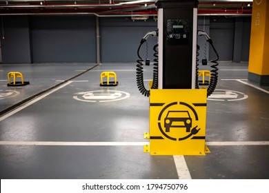 Electric car charging station. Electric car road sign for charging station - picture for electromobility presentations. Electro charging station. Electric car charging station on Shopping moll. 