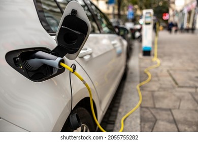 Electric car charging in street of Budapest - Shutterstock ID 2055755282