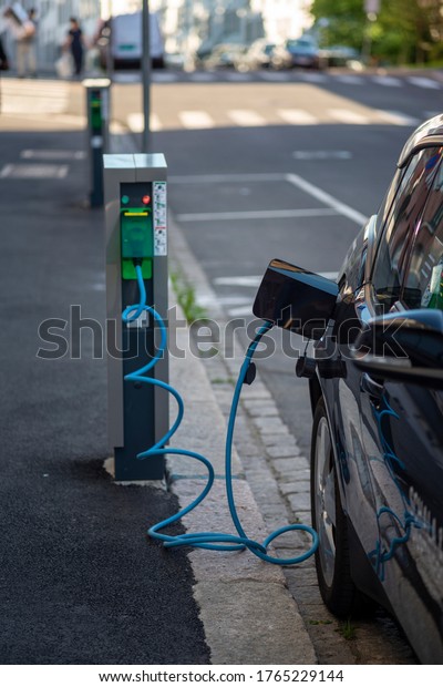 Electric car charging. Vehicle connected to a
power outlet.