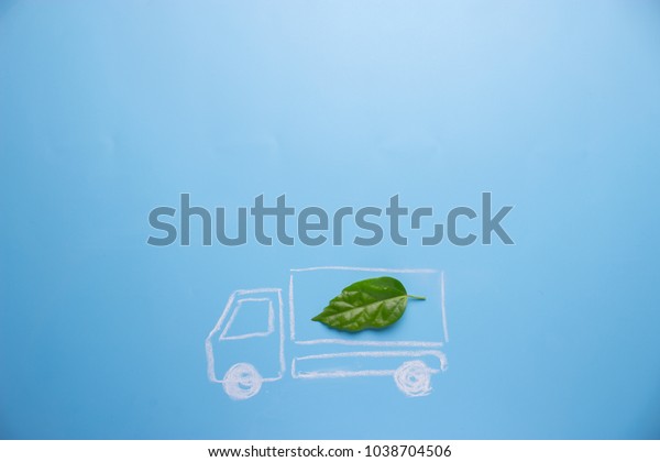 Electric car concept in green environment. lorry\
with green leaf