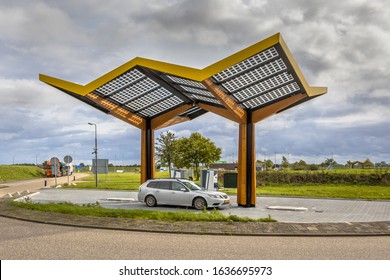 Electric Car Filling At Electricity Charge Station In The Fast Expanding Car Charging Network In The Netherlands