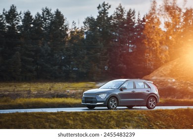 Electric Car Glides Down the Road in a Display of Modern Efficiency and Style - Powered by Shutterstock