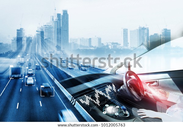 electric car or intelligent car.Heads up\
display(HUD).futuristic vehicle and graphical user\
interface(GUI).self-driving mode , autonomous car, vehicle running\
self driving mode and a woman\
driver